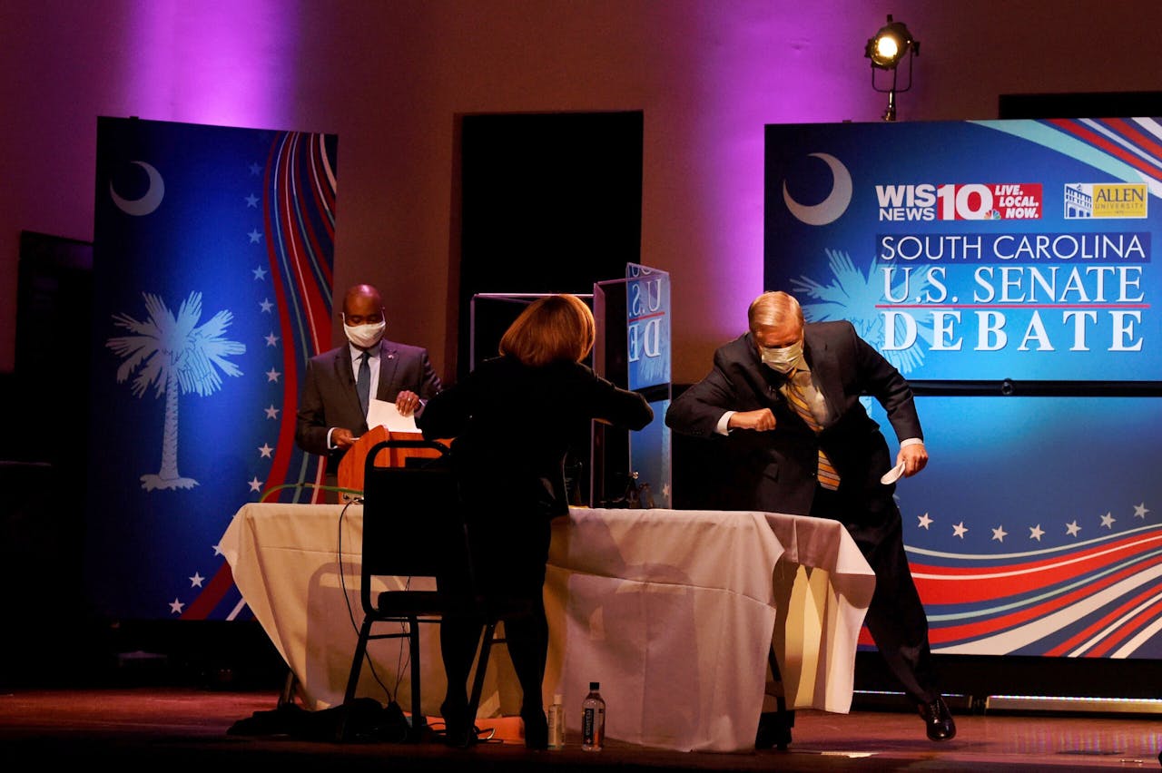Jaime Harrison en Lindsey Graham na afloop van hun eerste debat op 3 oktober. 